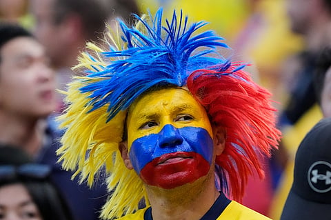 An Ecuadorian fan waits for the beginning of the World Cup Group E soccer match between Ecuador and Curacao in Kansas City