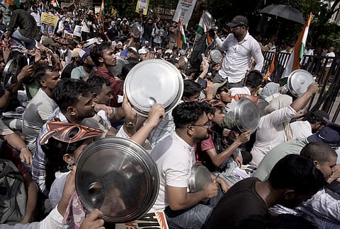 Cockroach Janta Party (CJP) supporters during a protest over alleged examination irregularities, repeated paper leaks and demands for accountability from the government, in New Delhi.