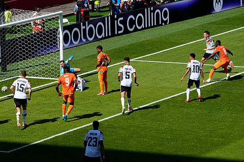 Ivory Coast's Franck Kessie, right scores their first goal past Germany goalkeeper Manuel Neuer (1) during the World Cup Group E soccer match.