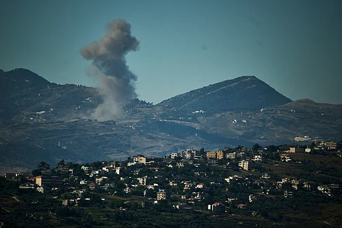 (AP Photo/Leo Correa) : Smoke rises to the sky following an Israeli military strike in southern Lebanon as seen from northern Israel, Friday, June 19, 2026.