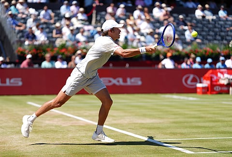 Alex De Minaur of Australia in action against Brandon Nakashima of the US in the men's singles quarterfinal match on day twelve of the Tennis Championships at The Queen's Club, in London.