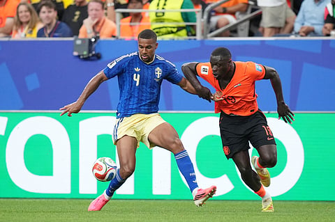 Sweden's Isak Hien, left, and Netherlands' Brian Brobbey vie for the ball during a World Cup Group F soccer match in Houston