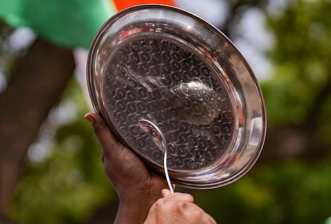 A Cockroach Janta Party (CJP) supporter during a protest over alleged examination irregularities, repeated paper leaks and demands for accountability from the government, in New Delhi.