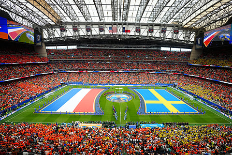 Teams line up on the pitch ahead of the World Cup Group F soccer match between the Netherlands and Sweden in Houston, Saturday
