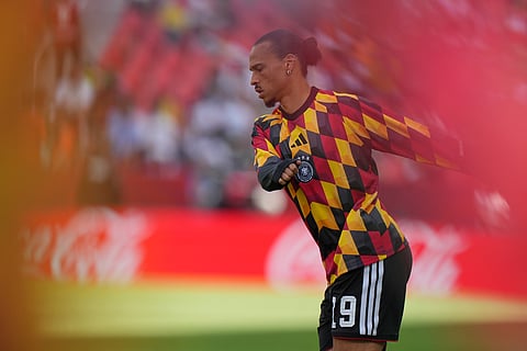 Germany's Leroy Sane, stretches as he warms up ahead of the World Cup Group E soccer match