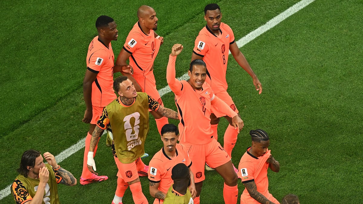 Netherlands' Virgil van Dijk (4) celebrates with teammates after scoring the opening goal during the World Cup Group F soccer match between the Netherlands and Japan in Arlington, Texas, near Dallas, Sunday, June 14, 2026. - AP Photo/Jessica Tobias