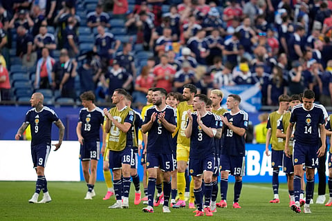 Scotland's players walk round the pitch applauding the fans after the end of the World Cup Group C soccer match between Scotland and Morocco in Foxborough, Mass., near Boston, Friday, June 19, 2026.
