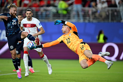 Paraguay goalkeeper Orlando Gill (12) and Isidro Pitta (25) clear the ball during the World Cup Group D soccer match between Turkey and Paraguay in Santa Clara, Calif., near San Francisco, Friday, June 19, 2026