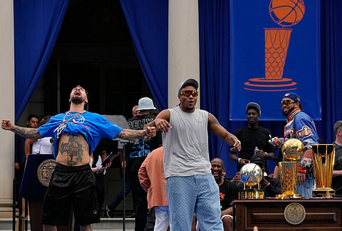 New York Knicks' Jose Alvarado, left, and Miles McBride celebrate during the New York Knicks' NBA championship parade in New York. 