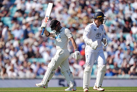 New Zealand's Henry Nicholls celebrates reaching 50 runs on day three of the second cricket test between England and New Zealand, in London.