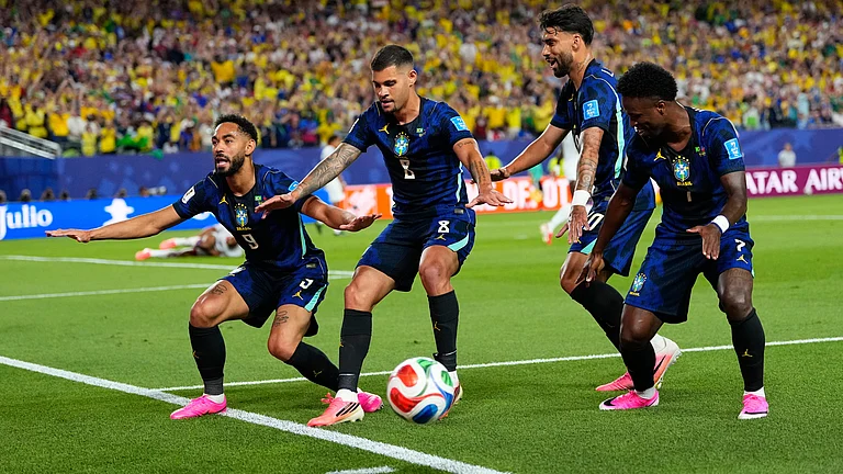Brazil's Matheus Cunha (9) celebrates after scoring his side's opening goal with teammates during the World Cup Group C soccer match between Brazil and Haiti in Philadelphia, Friday, June 19, 2026 - (AP Photo/Petr David Josek)
