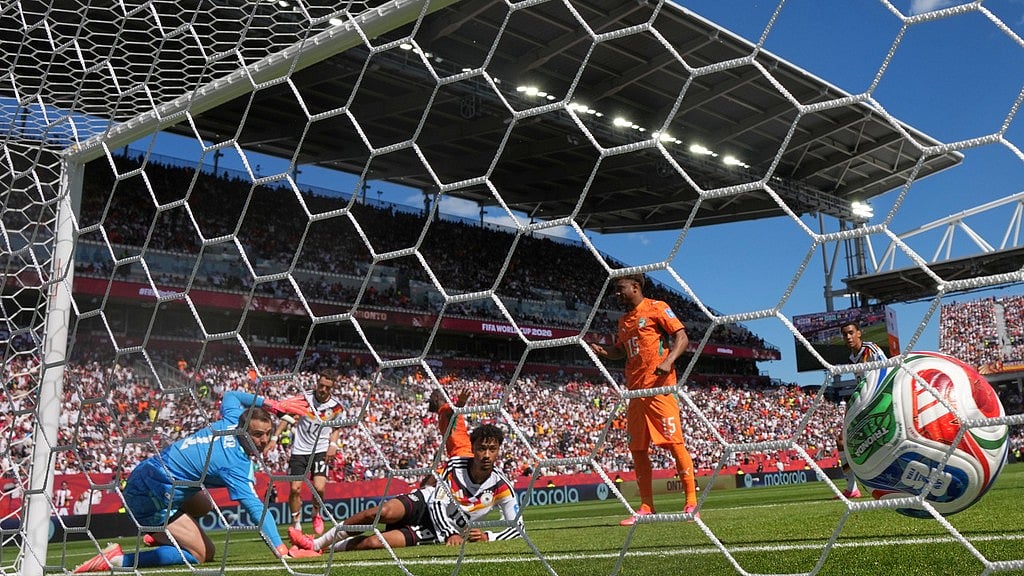 Ivory Coast's Franck Kessie (8) scores their opening goal during the World Cup Group E soccer match between Germany and Ivory Coast in Toronto. - AP Photo/Stephanie Scarbrough
