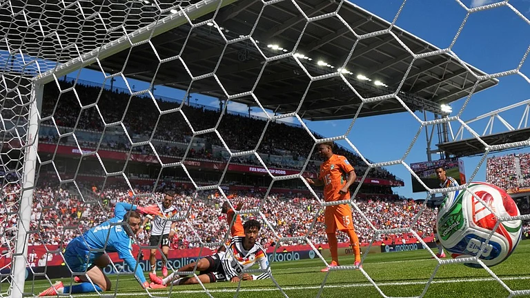 Ivory Coast's Franck Kessie (8) scores their opening goal during the World Cup Group E soccer match between Germany and Ivory Coast in Toronto. - AP Photo/Stephanie Scarbrough