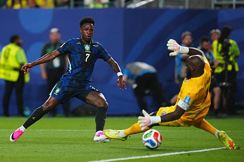 Brazil's Vinicius Junior (7) scores the third goal for his team against Haiti goalkeeper Johny Placide (1) during the World Cup Group C soccer match between Brazil and Haiti in Philadelphia, Friday, June 19, 2026.