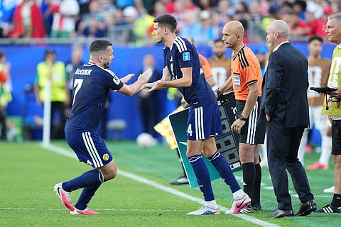 Scotland's John McGinn, left, shakes hands with Ross Stewart after being substituted during the World Cup Group C soccer match between Scotland and Morocco in Foxborough, Mass., near Boston, Friday, June 19, 2026.