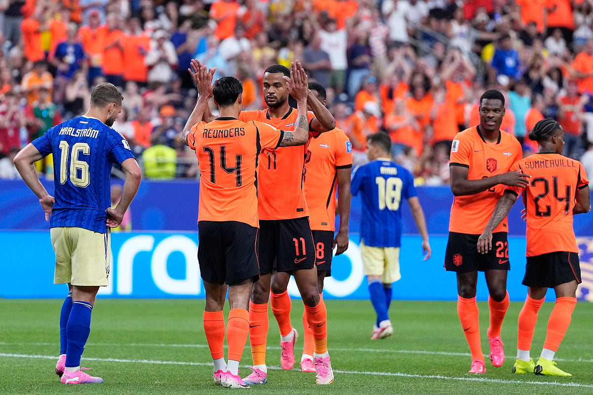 Netherlands' Cody Gakpo (11) celebrates after scoring his side's fourth goal during the World Cup Group F soccer match - AP