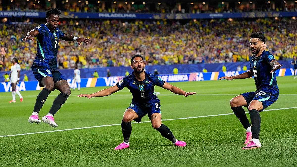 Brazil's Matheus Cunha (9) celebrates after scoring his side's second goal with Brazil's Vinicius Junior (7) and Lucas Paqueta (20) during the World Cup Group C soccer match between Brazil and Haiti in Philadelphia, Friday, June 19, 2026. - AP Photo/Petr David Josek