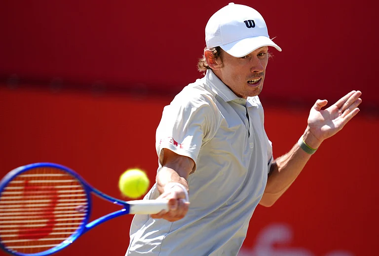 Alex De Minaur of Australia in action against Brandon Nakashima of the US in the men's singles quarterfinal match on day twelve of the Tennis Championships at The Queen's Club, in London. - | Photo: Adam Davy/PA via AP