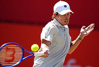 | Photo: Adam Davy/PA via AP : Alex De Minaur of Australia in action against Brandon Nakashima of the US in the men's singles quarterfinal match on day twelve of the Tennis Championships at The Queen's Club, in London.