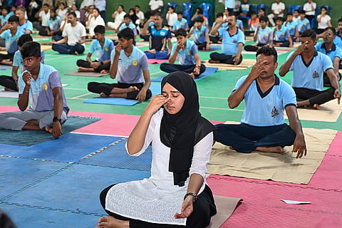 People perform yoga on the occasion of International Yoga Day, in Shivamogga, Karnataka.
