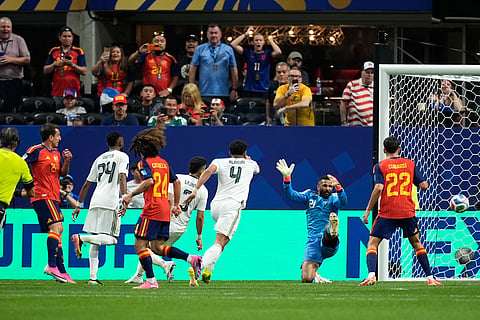Spain's Mikel Oyarzabal, left, scores his side's second goal during the World Cup Group H soccer match