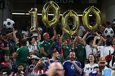 Fans hold balloons marking the 1,000th World Cup match prior to the Group F soccer match between Tunisia and Japan in Guadalupe, near Monterrey, Mexico, Saturday, June 20, 2026.