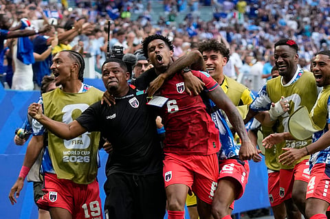 Cape Verde's Kevin Pina, center, celebrates with teammates after scoring the opening goal during the World Cup Group H soccer match between Uruguay and Cape Verde in Miami Gardens