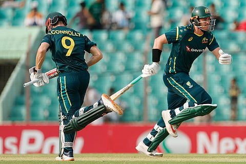 Australia's Matt Renshaw, right, and Cooper Connolly run between the wickets to score during the third T20 international cricket match between Australia and Bangladesh, in Chattogram, Bangladesh.