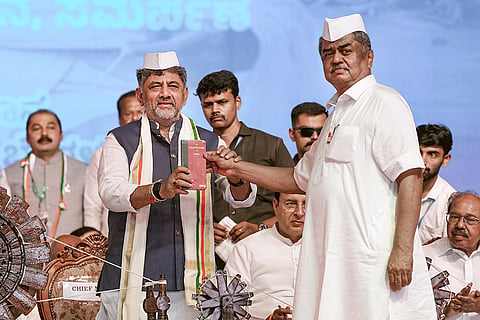 Karnataka Chief Minister DK Shivakumar with senior Congress leader BK Hariprasad during the charge handover ceremony of the Karnataka Pradesh Congress Committee (KPCC) president, in Bengaluru, Karnataka.