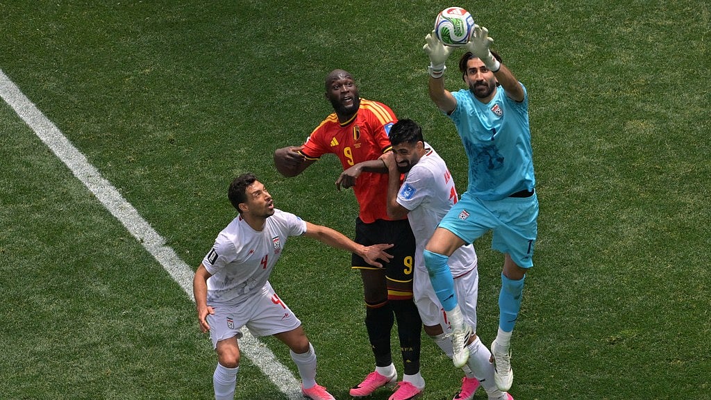 Iran goalkeeper Alireza Beiranvand (1) saves during the World Cup Group G soccer match between Belgium and Iran in Inglewood, Calif., near Los Angeles. - Jayne Kamin-Oncea/AP Photo
