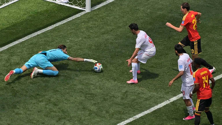 Iran goalkeeper Alireza Beiranvand (1) saves during the World Cup Group G soccer match between Belgium and Iran in Inglewood, Calif. - Jayne Kamin-Oncea/AP Photo