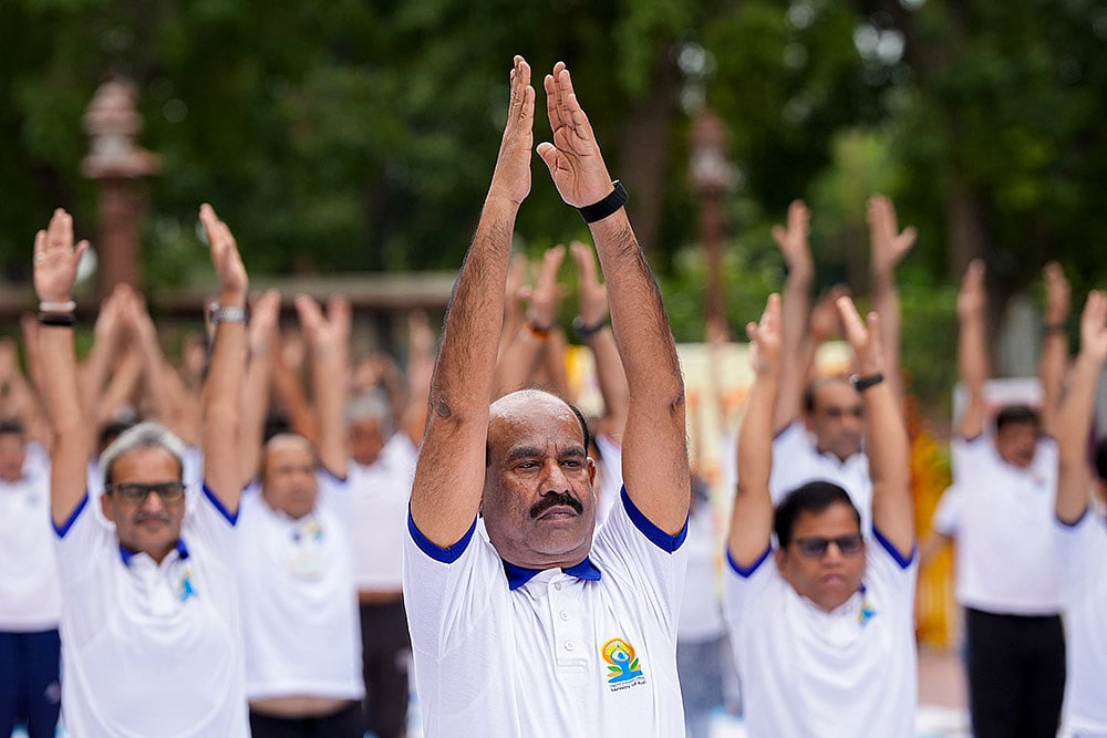 Om Birla performs yoga