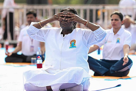 President Droupadi Murmu performs yoga during a session on the International Day of Yoga, in Jabalpur, Madhya Pradesh.