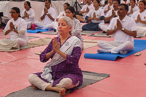 Union Finance Minister Nirmala Sitharaman performs yoga during a session on the occasion of the International Day of Yoga, in Guwahati.