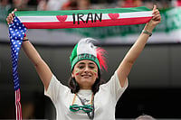 AP/Andre Penner : A fan of Iran holds up a scarf prior to the World Cup Group G soccer match between Belgium and Iran in Inglewood, Calif.