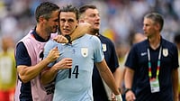 Rebecca Blackwell/AP Photo : Uruguay's Agustin Canobbio (14) is congratulated by a team official after scoring his team's second goal during the World Cup Group H soccer match between Uruguay and Cape Verde in Miami Garden.