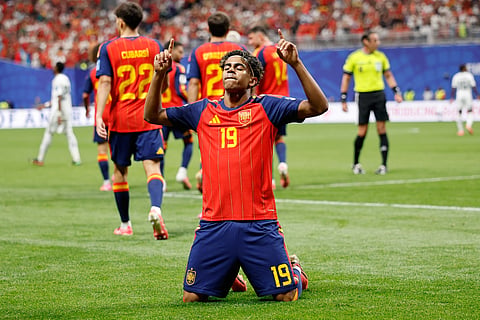 Spain's Lamine Yamal celebrates after scoring his side's opening goal during the World Cup Group H soccer match.