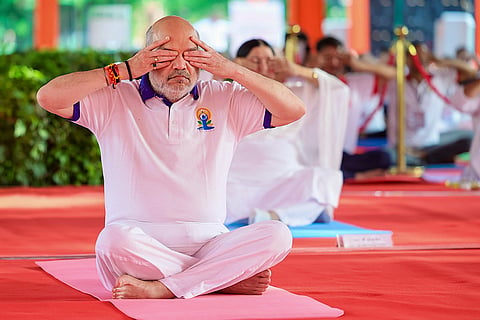 In this image received on June 21, 2026, Union Home Minister Amit Shah during a yoga session on the occasion of the International Day of Yoga, in Ahmedabad.