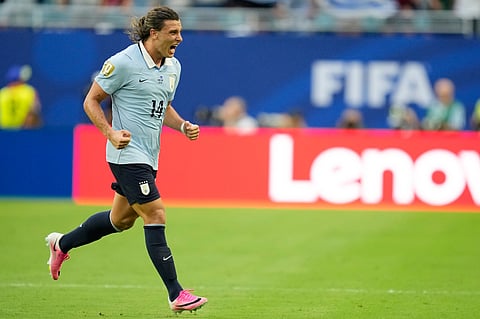 Uruguay's Agustin Canobbio (14) celebrates after scoring his team's second goal during the World Cup Group H soccer match between Uruguay and Cape Verde in Miami Gardens