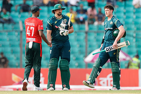 Bangladesh's Shoriful Islam congratulates Australia's Tim David after Australia won the third T20 international cricket match against Bangladesh, in Chattogram, Bangladesh.
