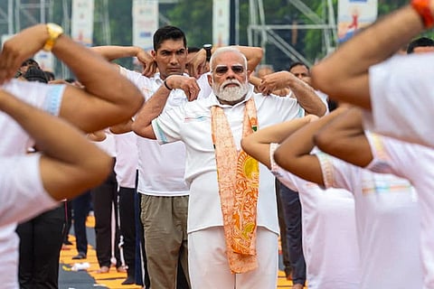 In this image posted on June 21, 2026, Prime Minister Narendra Modi participates in a yoga session during the International Day of Yoga celebrations, in Kolkata.