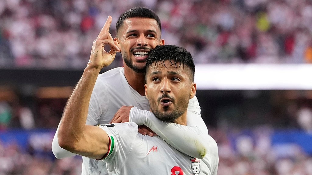 Iran's Mohammad Mohebbi (8) celebrates after scoring his side's second goal alongside Mehdi Ghayedi (10) during the World Cup Group G soccer match between Iran and New Zealand in Inglewood. - AP Photo/Mark J. Terrill