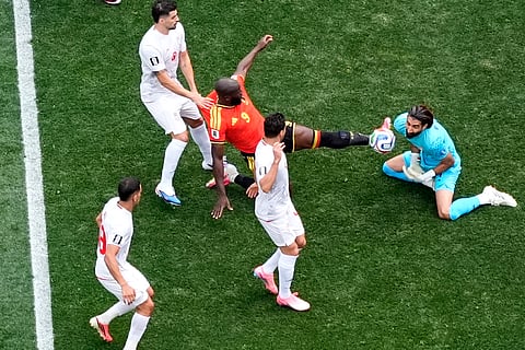 Belgium's Romelu Lukaku (9) challenges Iran goalkeeper Alireza Beiranvand (1) during the World Cup Group G soccer match between Belgium and Iran in Inglewood, Calif., near Los Angeles