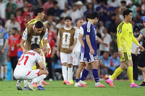 Tunisia's Raed Chikhaoui (24) consoles teammate Mohamed Amine Ben Hmida (21) after the World Cup Group F soccer match between Tunisia and Japan in Guadalupe, near Monterrey, Mexico, Saturday, June 20, 2026.