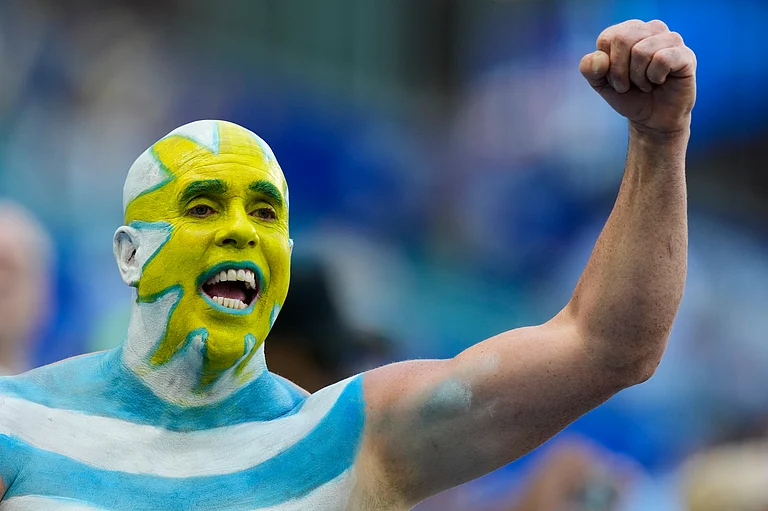 Fans react ahead of the World Cup Group H soccer match between Uruguay and Cape Verde in Miami Gardens - AP/Rebecca Blackwell