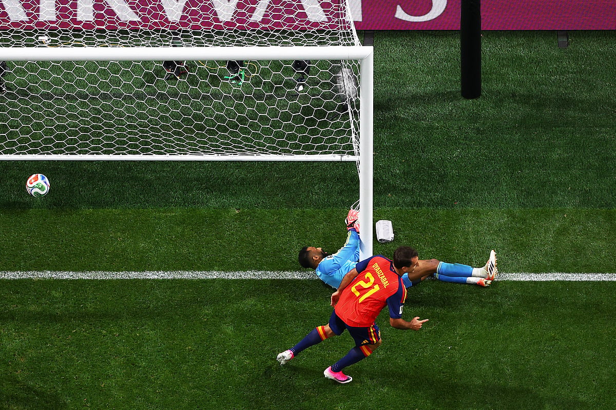 Spain's Mikel Oyarzabal (21) celebrates after scoring against Saudi Arabia. - AP
