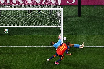 AP : Spain's Mikel Oyarzabal (21) celebrates after scoring against Saudi Arabia.