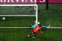 AP : Spain's Mikel Oyarzabal (21) celebrates after scoring against Saudi Arabia.
