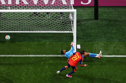 Spain's Mikel Oyarzabal (21) celebrates after scoring against Saudi Arabia.