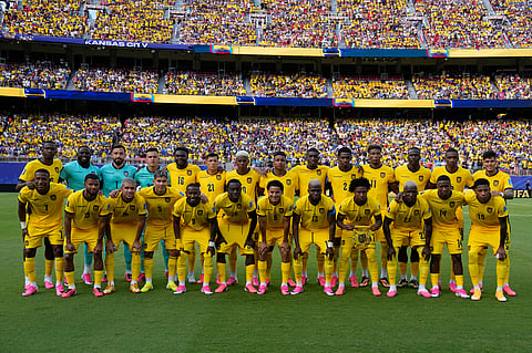 Ecuador's players pose for a team photo at the beginning of the World Cup Group E soccer match against Curacao in Kansas City